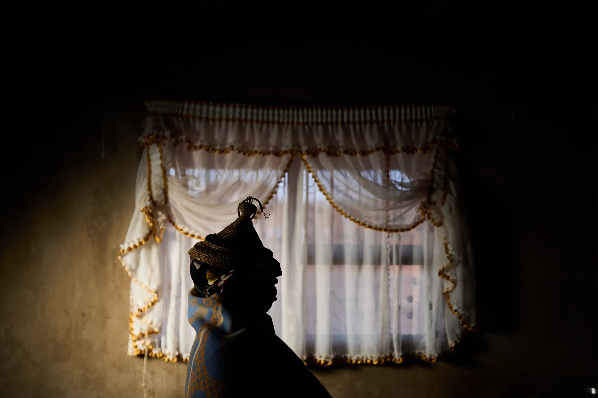 Woman wearing a hat posing for a portrait