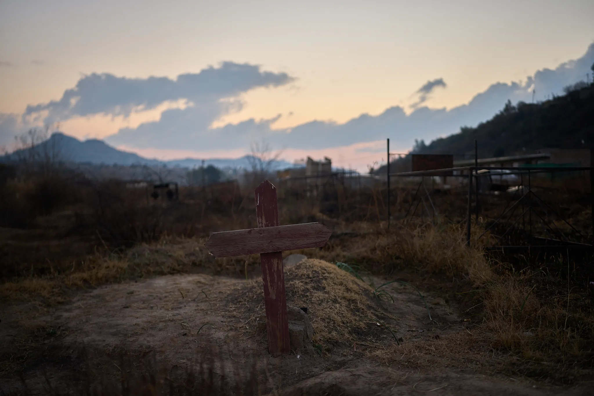 wooden cross in a cemetery