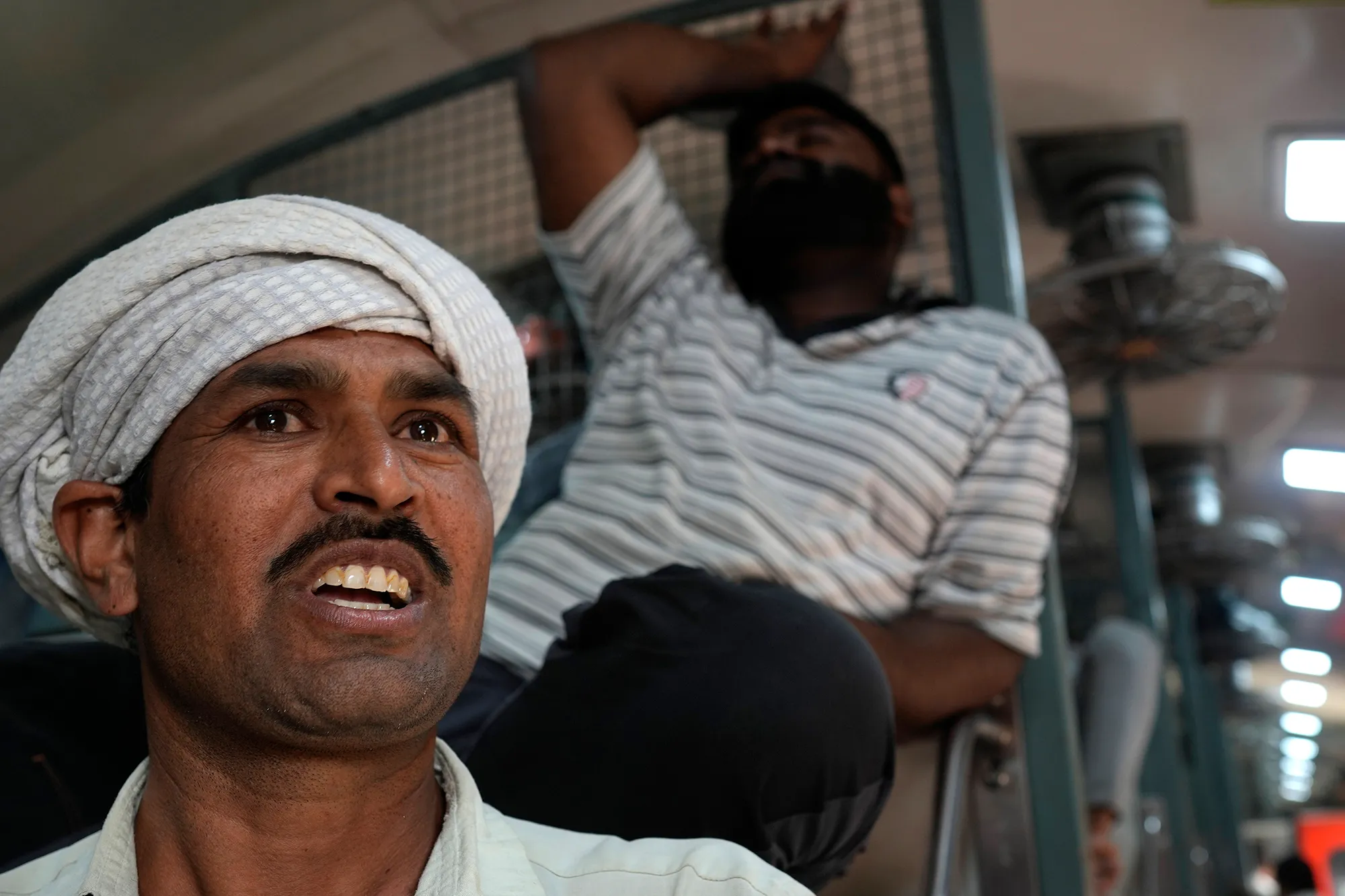2 men in an Indian train carriage
