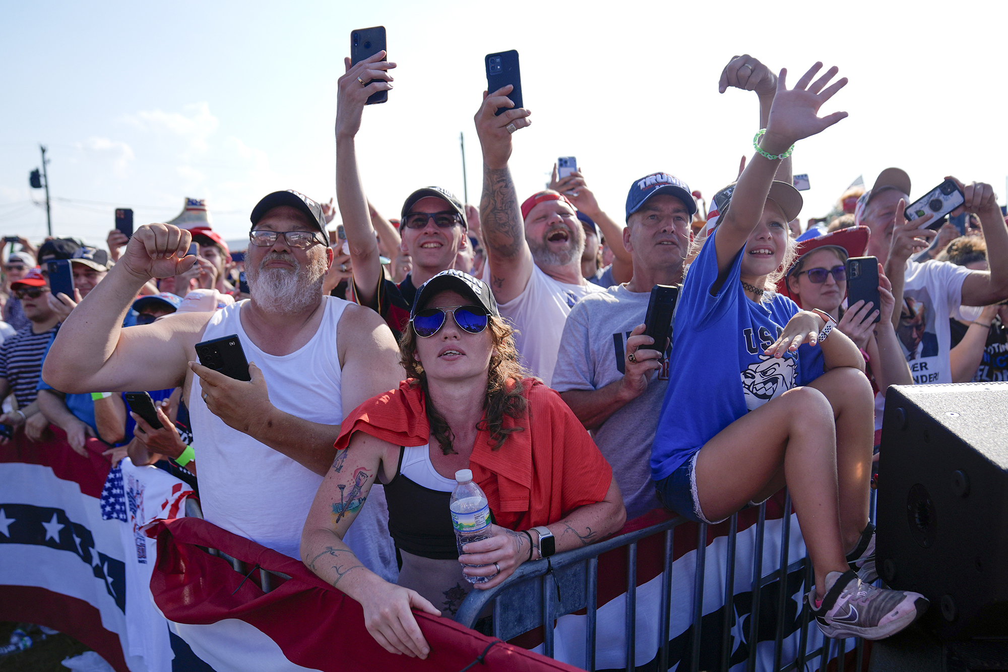 Crowd cheering at a rally